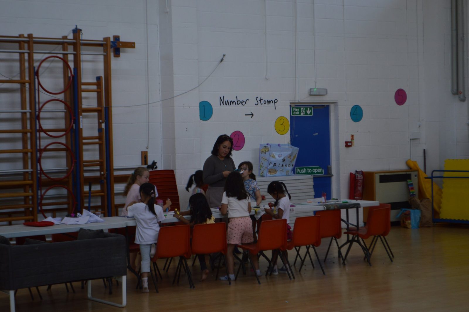 Children at the craft table in the school hall