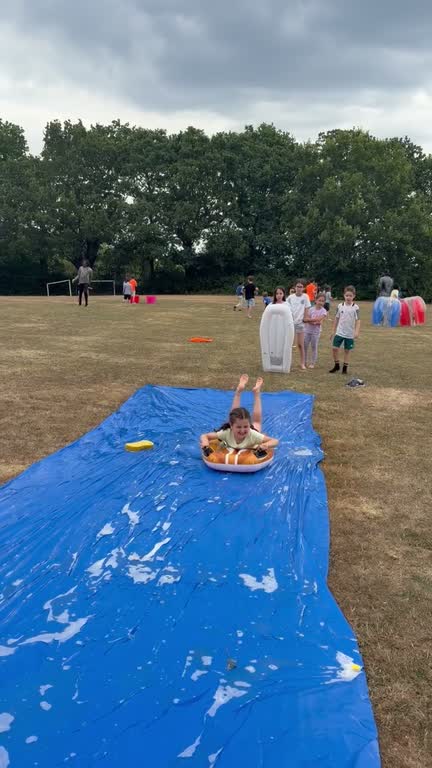 Children playing on the field at summer camp
